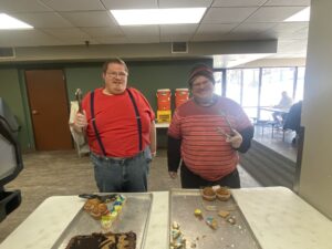 Mike and a friend serve dessert at Hope Cafe