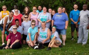 A group of Optimae employees at a park